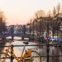 Bike leaning against a bridge in Amsterdam