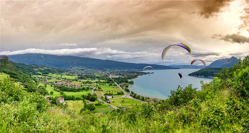 Paragliders by the lake of Annecy, France