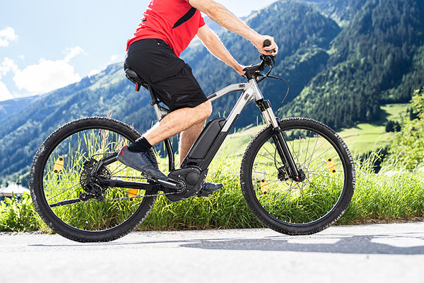 Man Riding Electric Mountain Bike Or E Bike In Alps