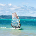 Windsurfer on a sunny day with blue hues everywhere