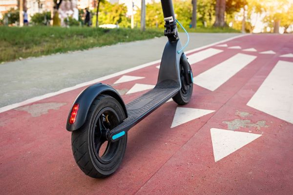 An electric kickscooter on a designated path.