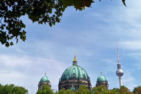 Berliner Dom and the television tower. Blue sky with thin clouds.