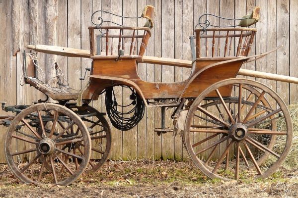 Old coach by stables.