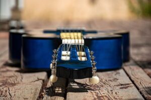 Blue guitar on wood planks