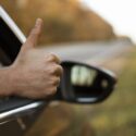 Thumbs up from car.