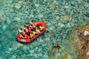 Rafting in shallow river.