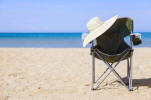 Beach chair and lady's hat.